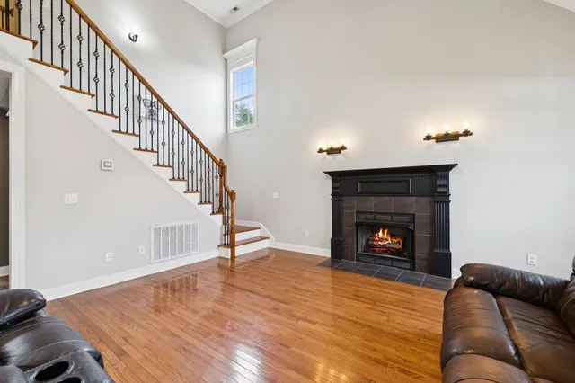 a kitchen with stainless steel appliances granite countertop a stove sink and cabinets