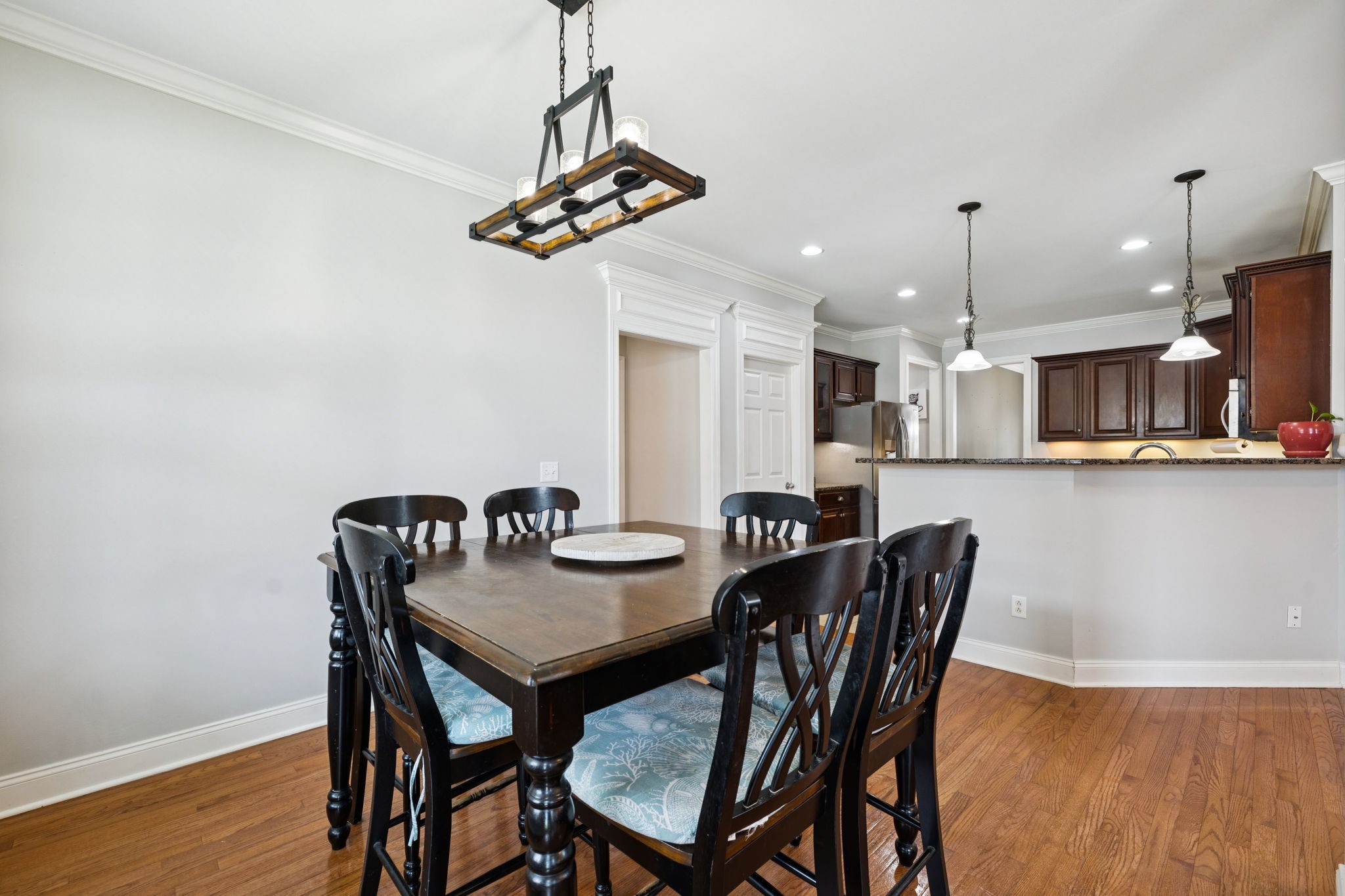 3002 Stow Crossing Murfreesboro, TN 37128 - Photo 30 of 75 a view of a dining room with furniture wooden floor and chandelier