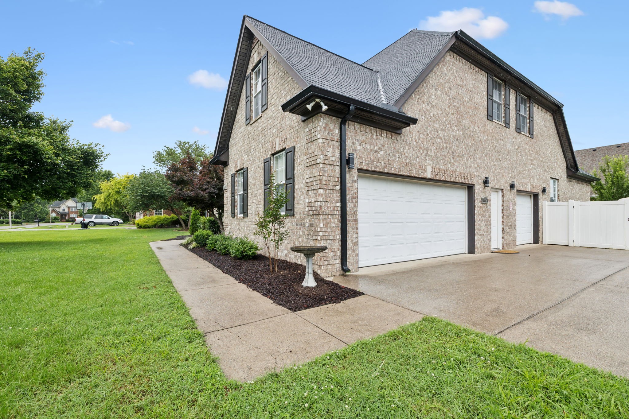 3002 Stow Crossing Murfreesboro, TN 37128 - Photo 3 of 75 a front view of a house with a yard and garage