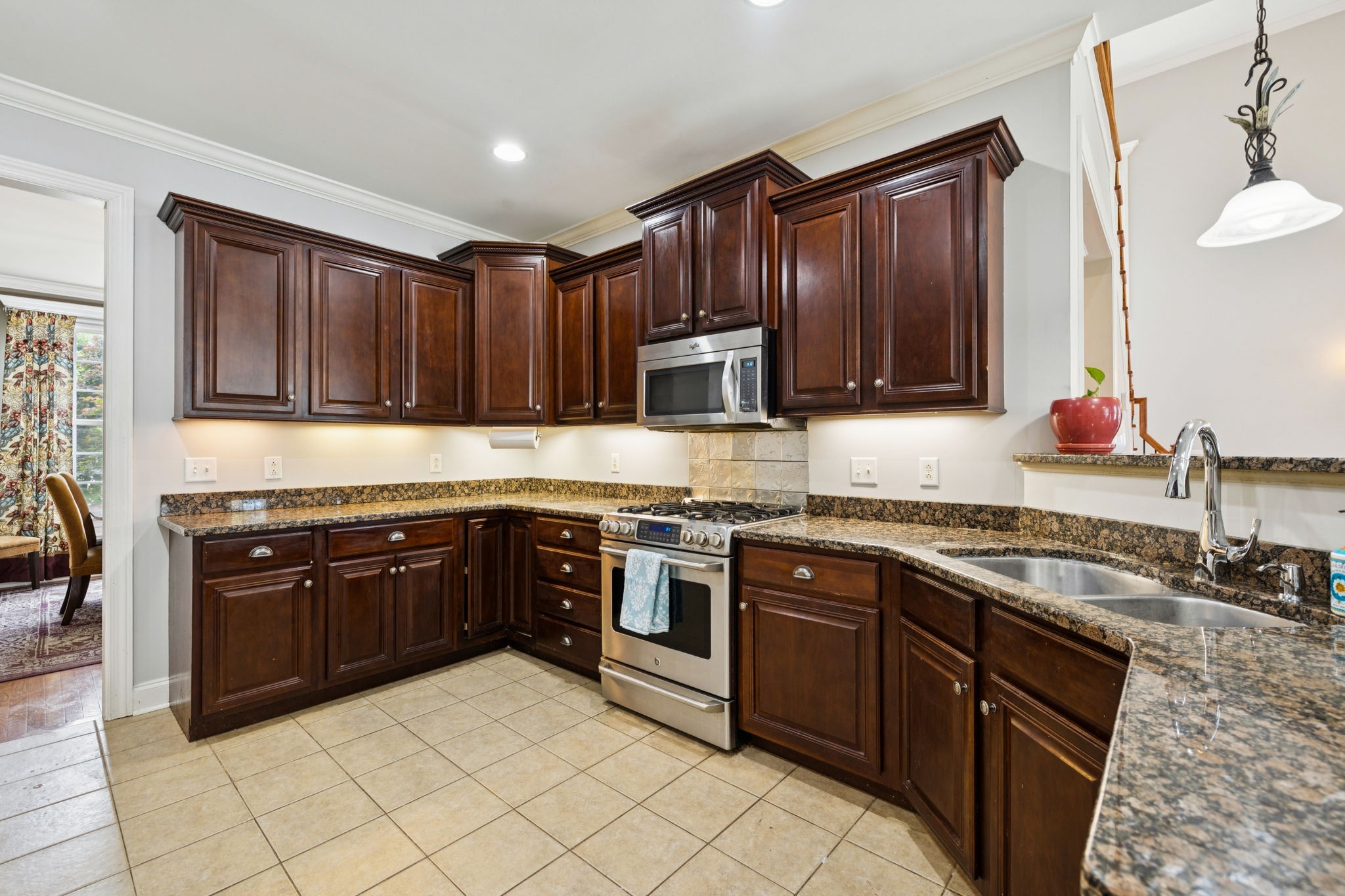 3002 Stow Crossing Murfreesboro, TN 37128 - Photo 32 of 75 a kitchen with stainless steel appliances granite countertop a stove sink and cabinets