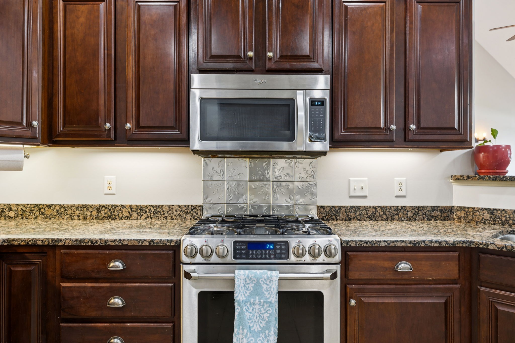 3002 Stow Crossing Murfreesboro, TN 37128 - Photo 35 of 75 a kitchen with granite countertop wooden cabinets appliances and a sink