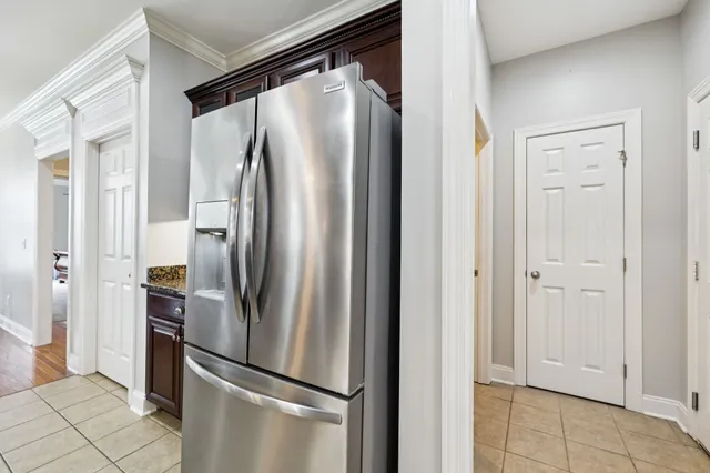 a bathroom with a toilet and shower curtain