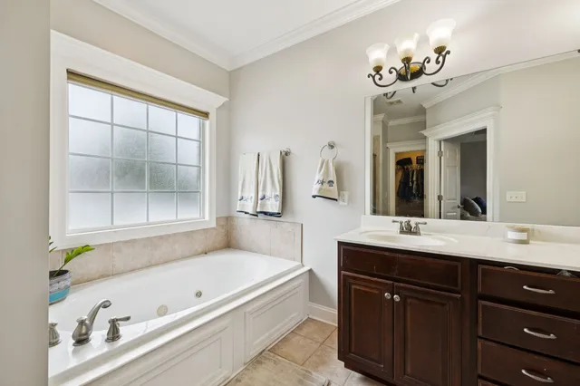 a view of an empty room with a ceiling fan