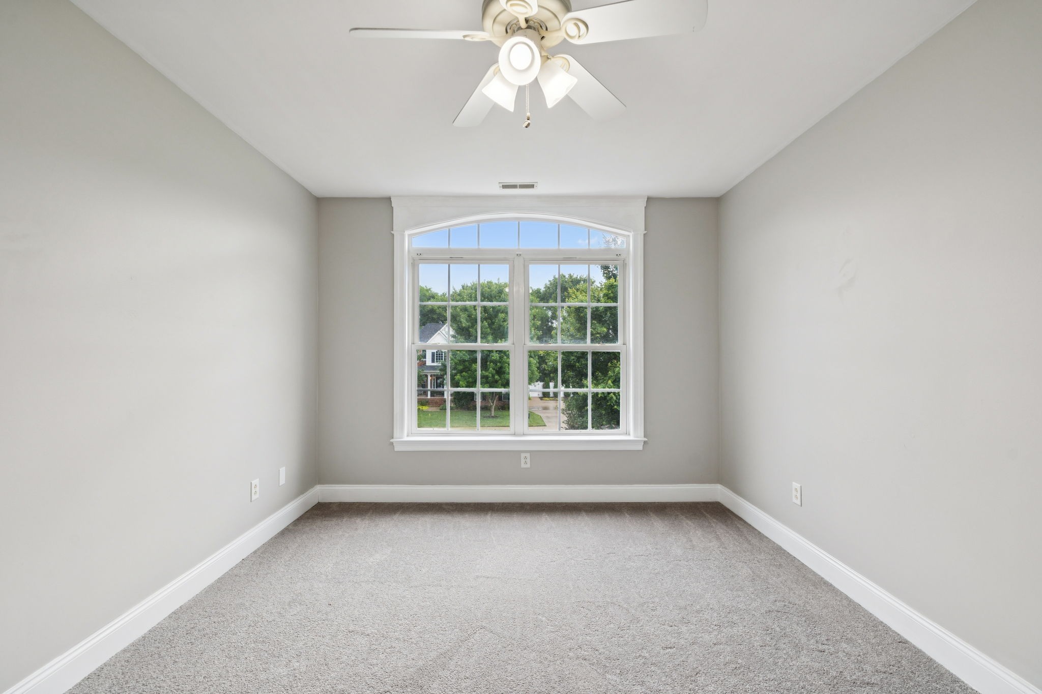 3002 Stow Crossing Murfreesboro, TN 37128 - Photo 54 of 75 an empty room with a window and a ceiling fan