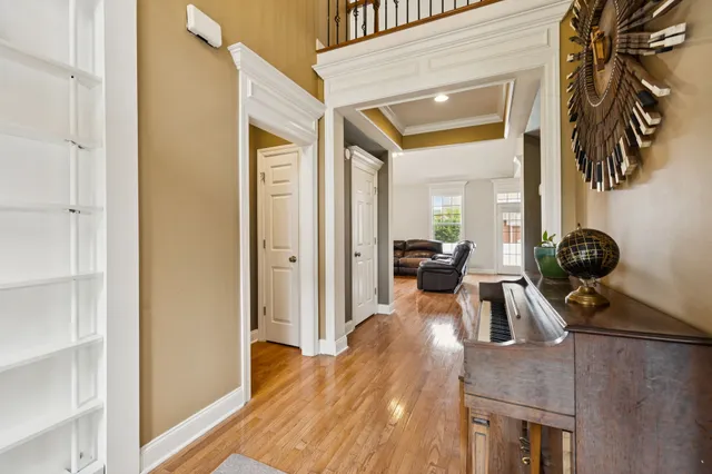 a view of a dining room with furniture and chandelier