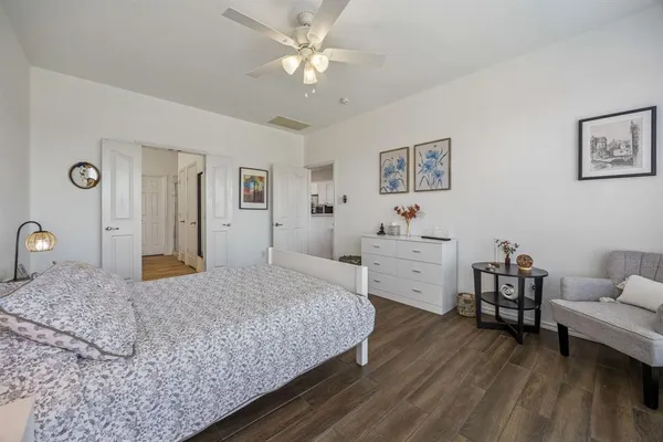 a bedroom with a bed and a couch