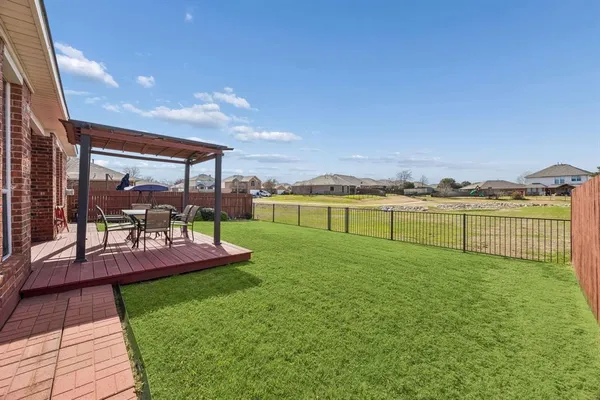 a view of a swimming pool and a yard