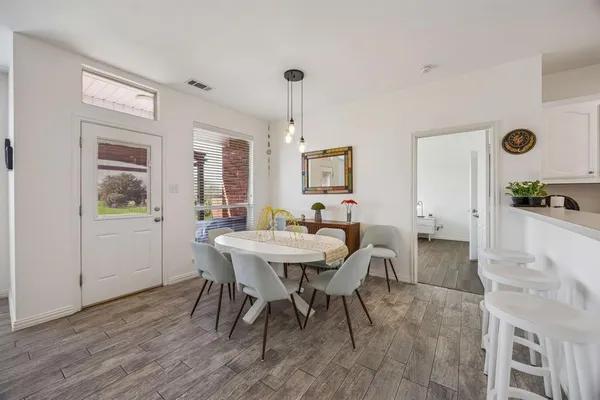 a view of a dining room with furniture and window