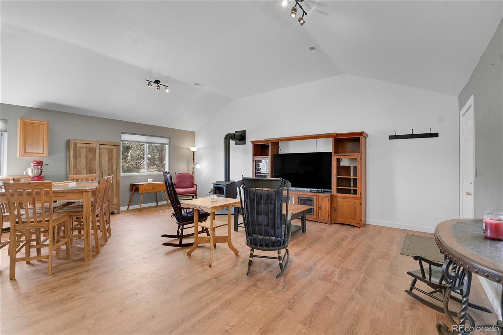 214 Conestoga Road Bailey, CO 80421 - Photo 17 of 30 a view of a livingroom with furniture and a flat screen tv