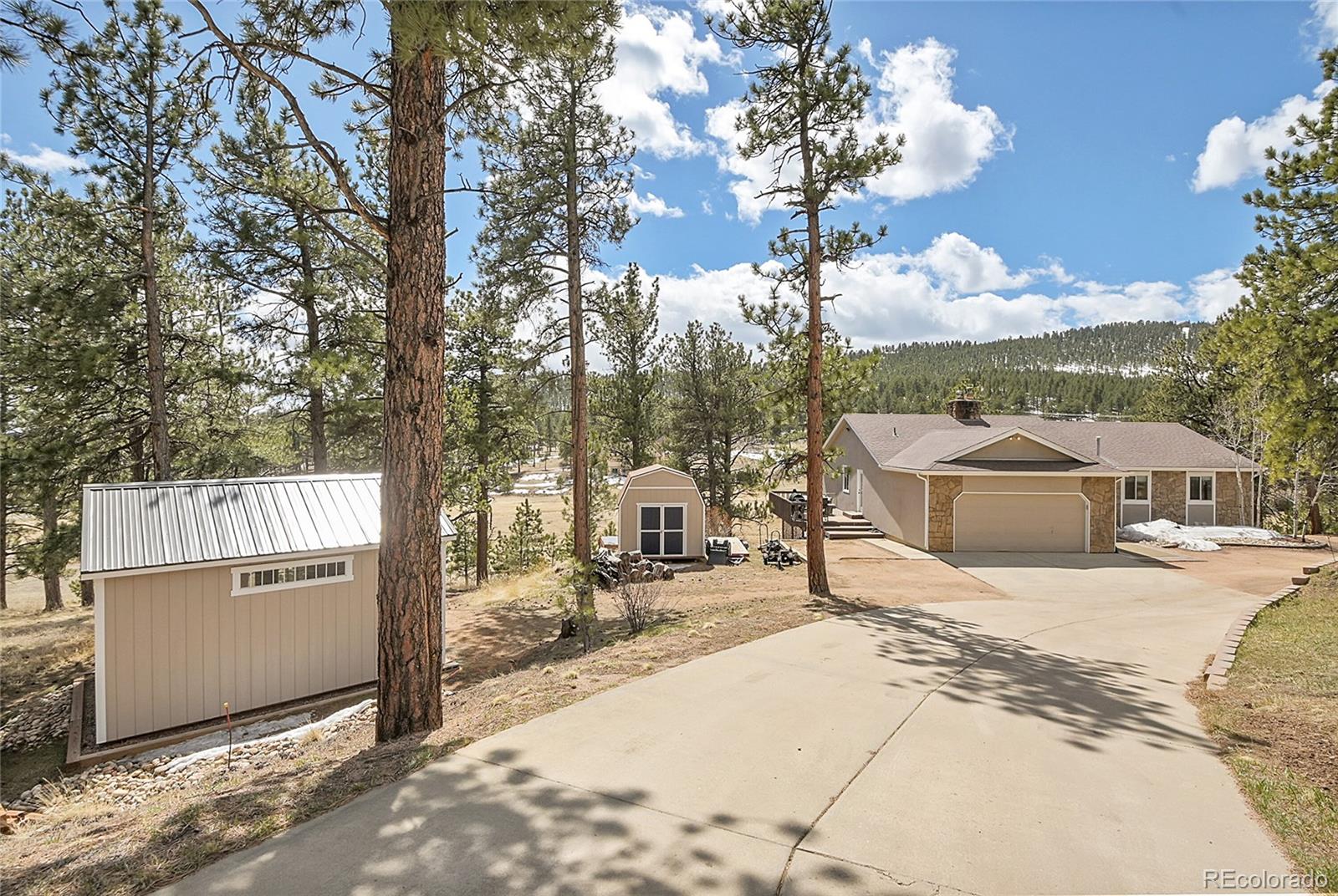 214 Conestoga Road Bailey, CO 80421 - Photo 22 of 30 a view of a house with a outdoor space