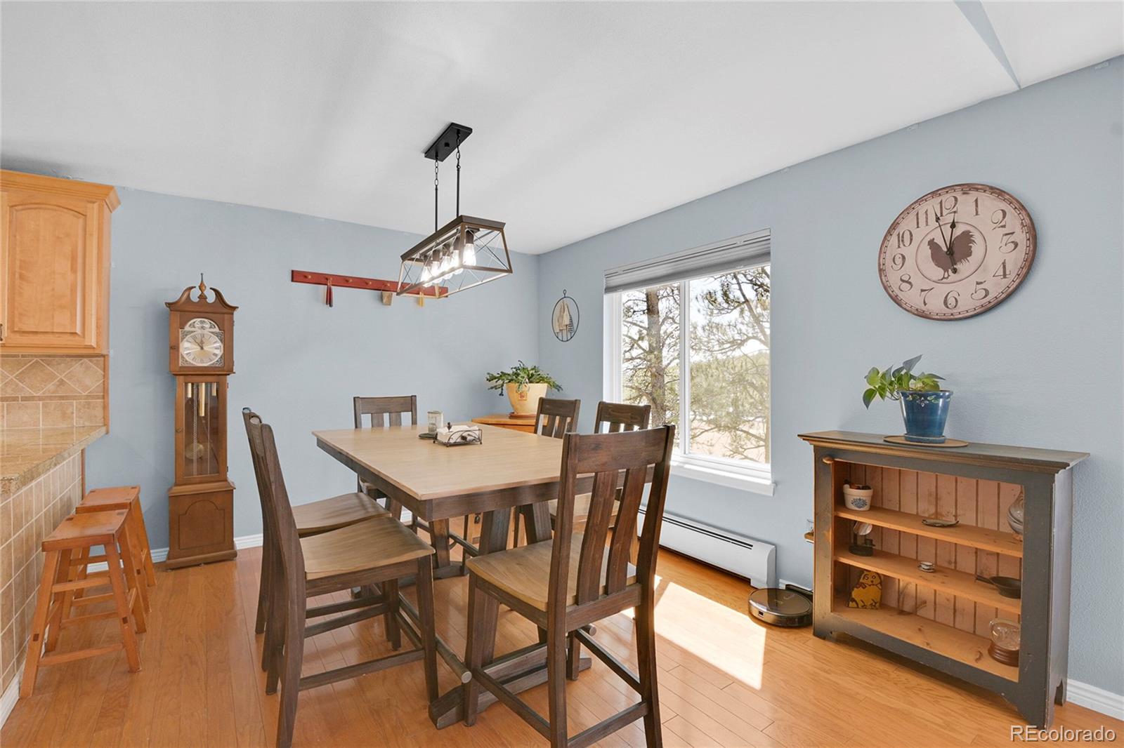 214 Conestoga Road Bailey, CO 80421 - Photo 7 of 30 a view of a dining room with furniture window and wooden floor