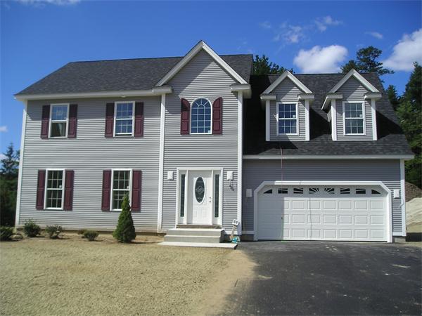 66 Bethany Road Monson, MA 01057 - Photo 1 of 1 a front view of a house with a yard and garage