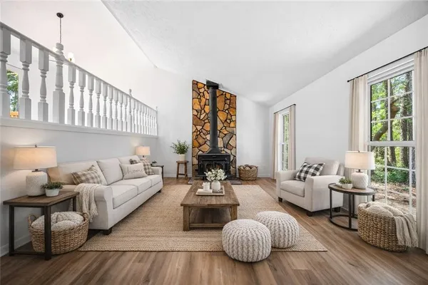a living room with furniture or couch and a large window