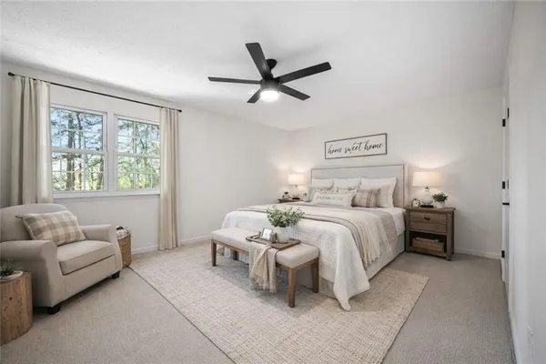 a bedroom with a bed and a couch