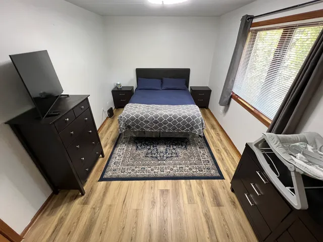 a living room with furniture and a rug