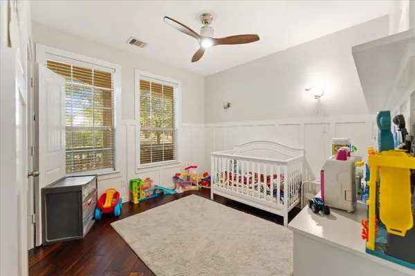 a bedroom with furniture and a window