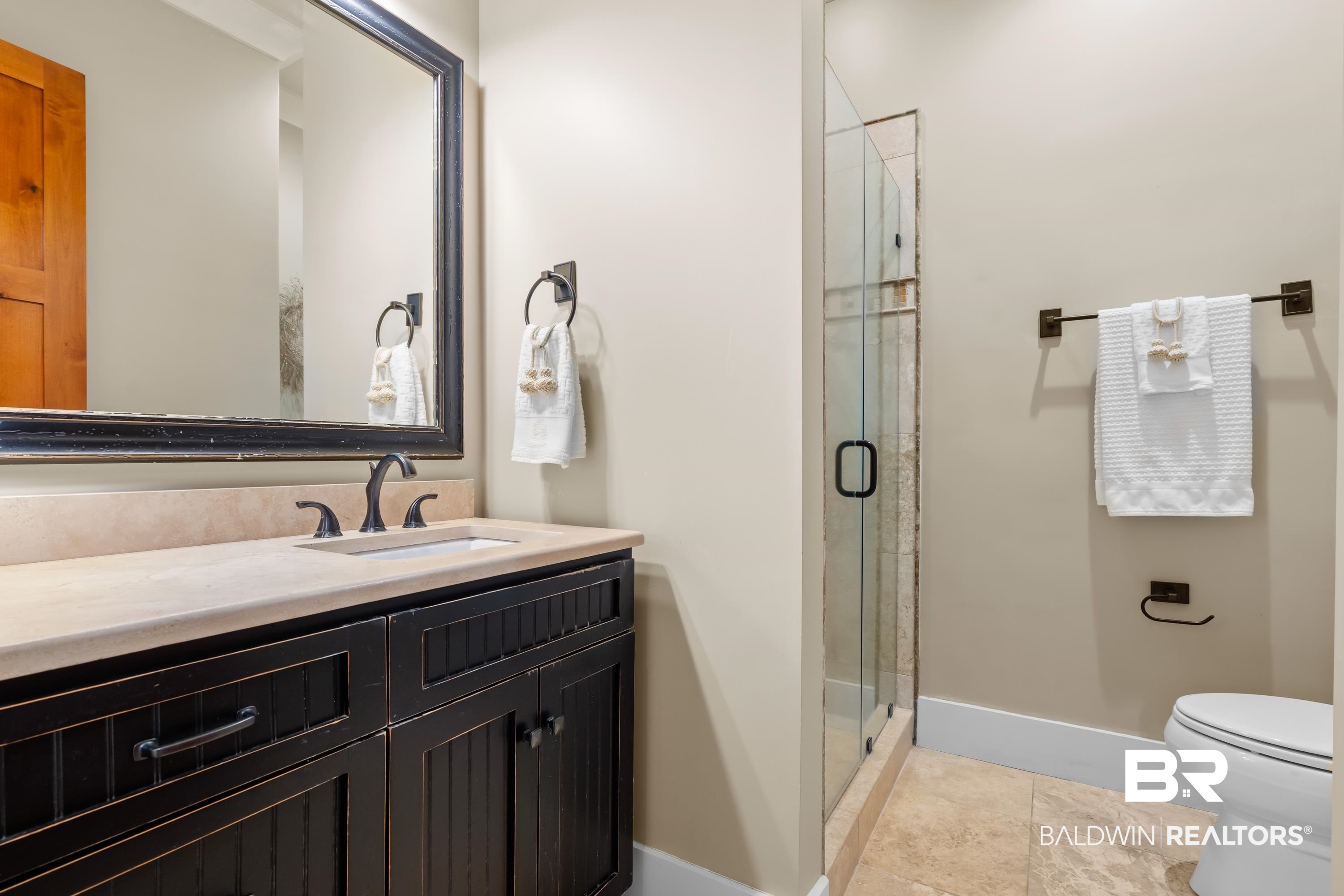 30057 Dolive Ridge Daphne, AL 36527 - Photo 24 of 55 Bathroom featuring tile patterned flooring, vanity, toilet, and a shower with shower door