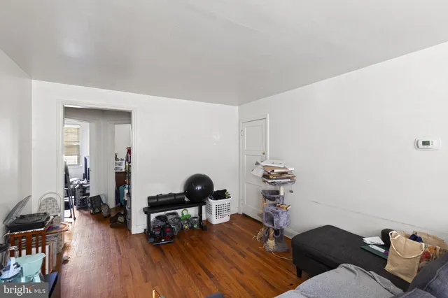 a workspace with furniture wooden floor and windows