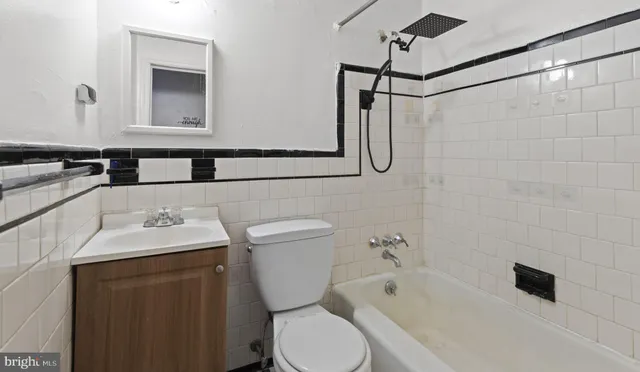 a view of an empty room and closet area