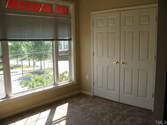 2511 Friedland Place, Unit 200 Raleigh, NC 27617 - Photo 6 of 12 an empty room with a window