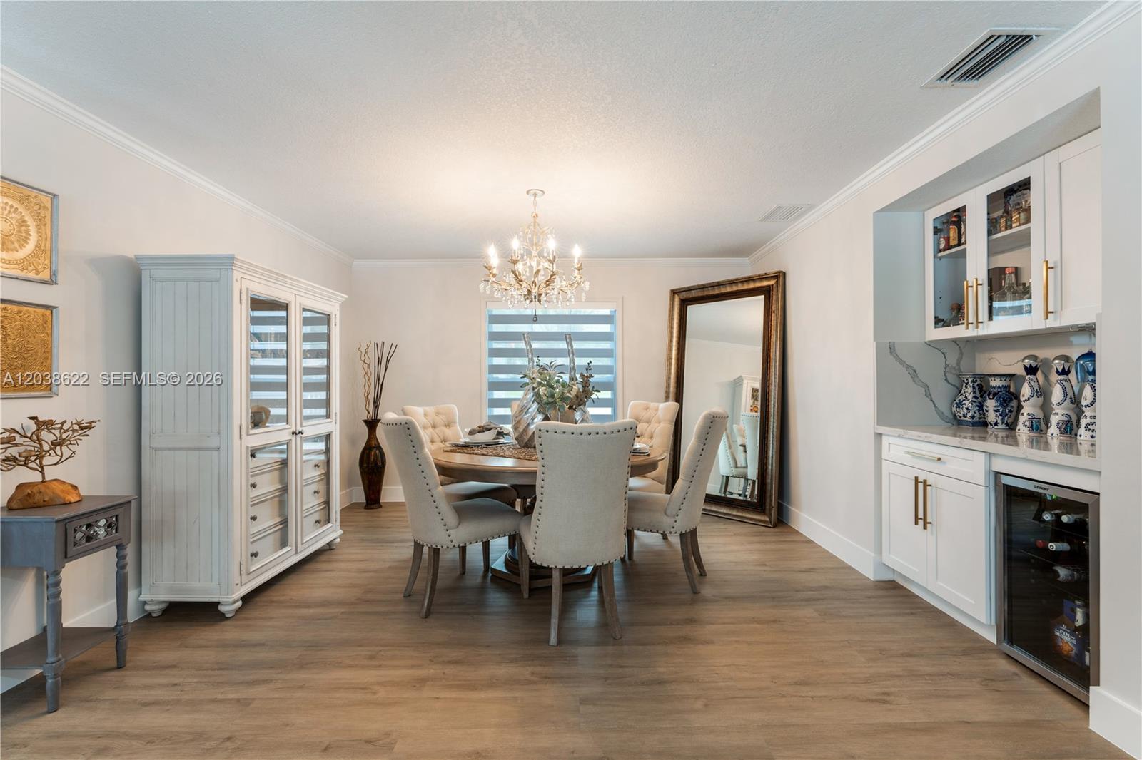 14830 Southwest 149th Street Miami, FL 33196 - Photo 9 of 43 a view of a dining room with furniture window and wooden floor