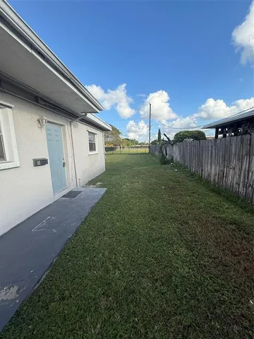 a backyard of a house with lots of green space