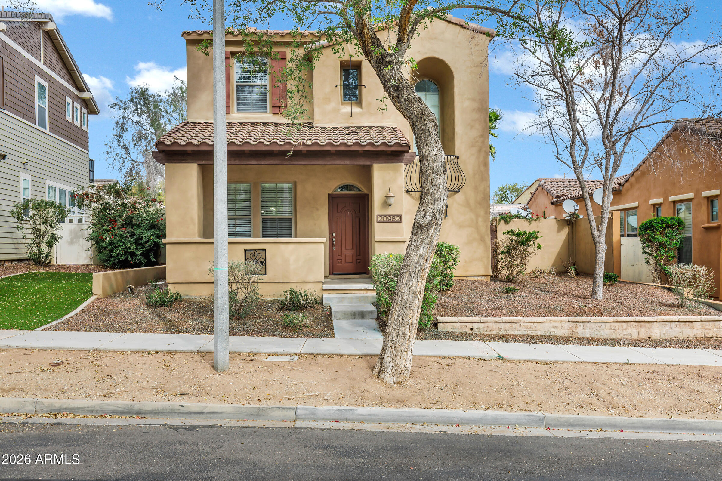 front view of a house with a yard