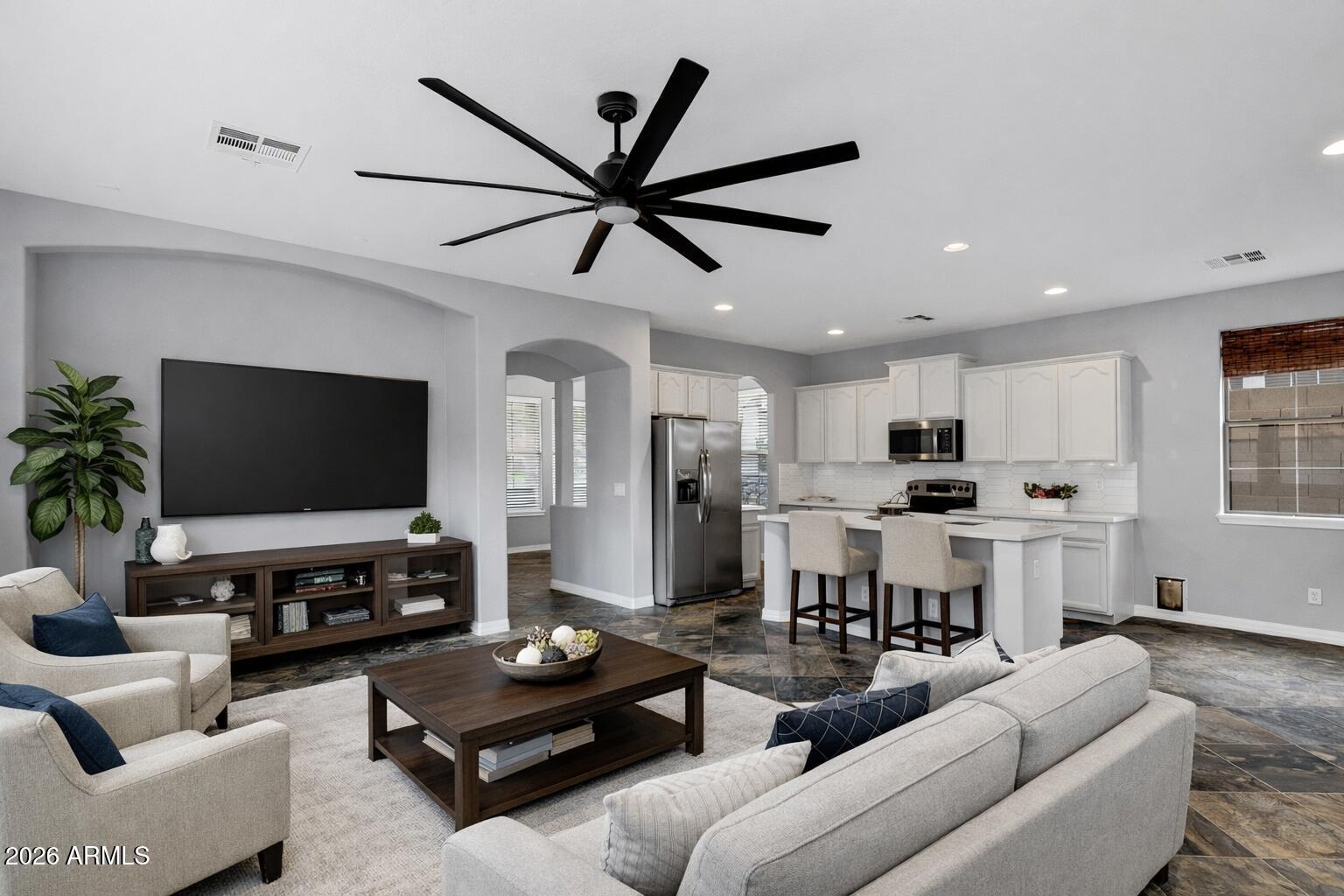 20982 West Edith Way Buckeye, AZ 85396 - Photo 18 of 57 a living room with furniture and a flat screen tv