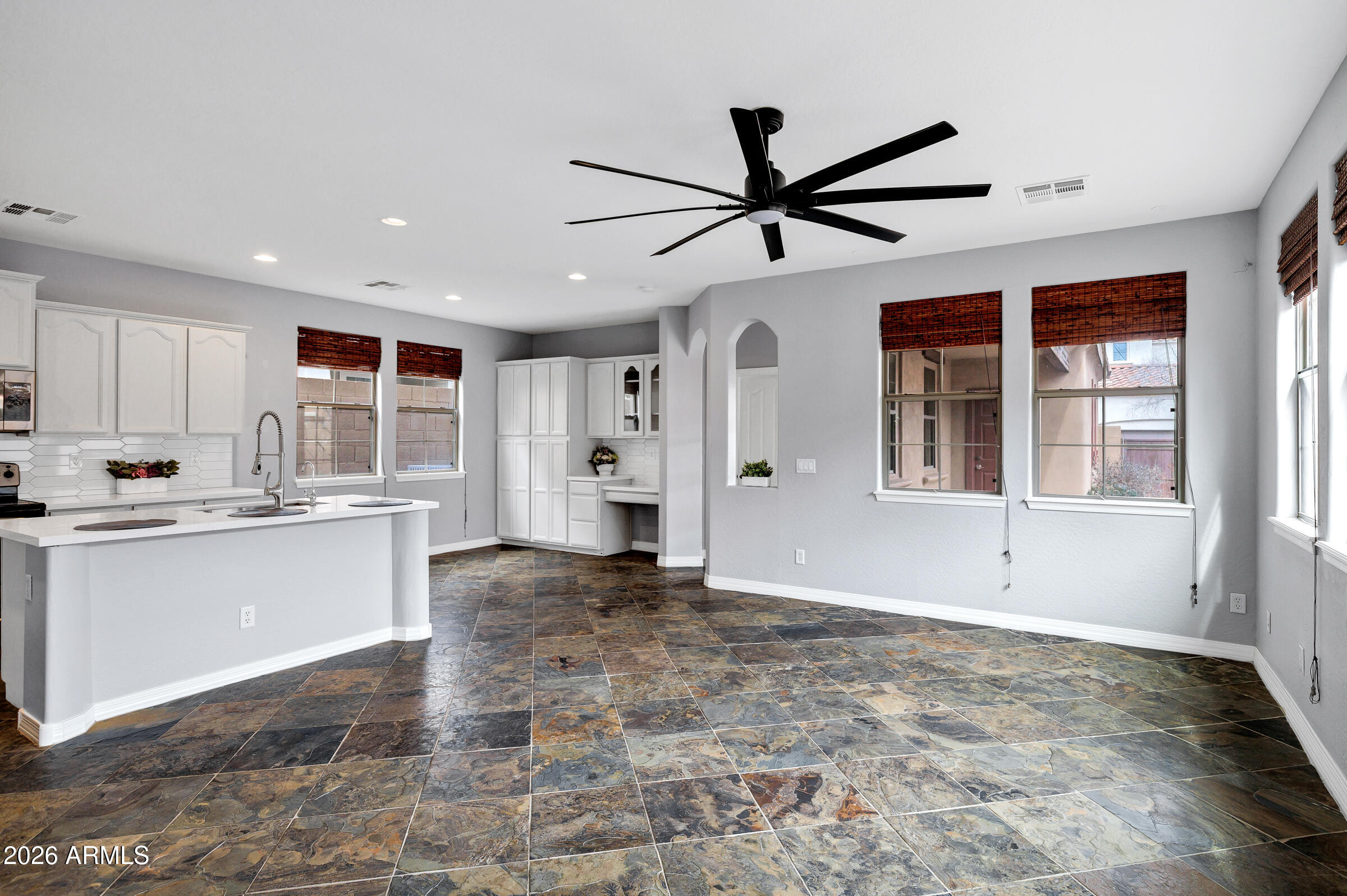20982 West Edith Way Buckeye, AZ 85396 - Photo 19 of 57 a view of a kitchen with a sink and microwave