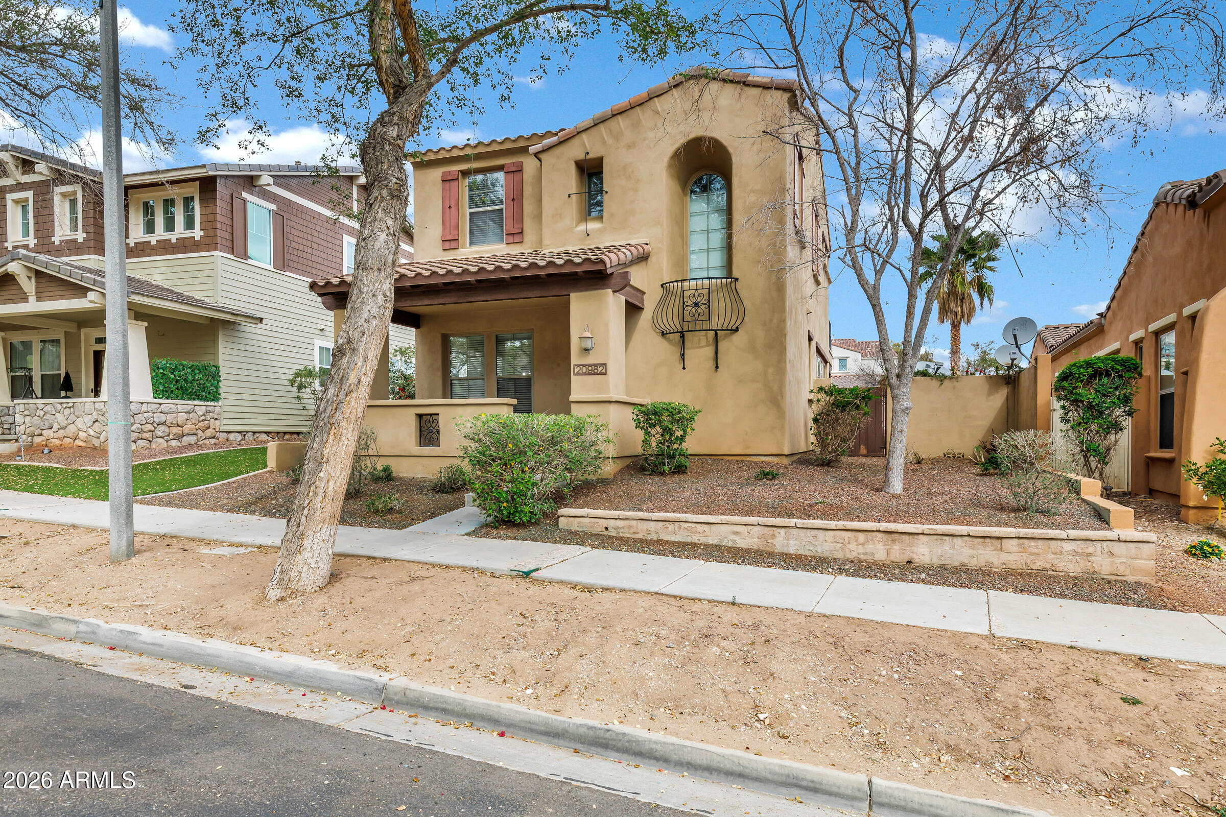 20982 West Edith Way Buckeye, AZ 85396 - Photo 2 of 57 a front view of a house with garden