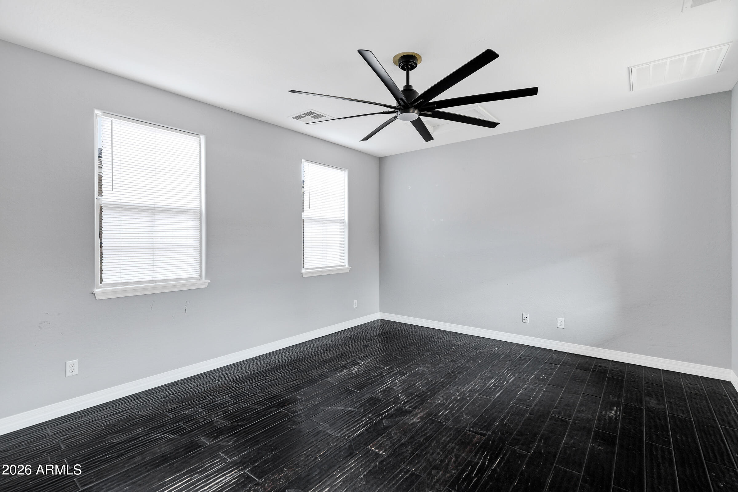 20982 West Edith Way Buckeye, AZ 85396 - Photo 21 of 57 wooden floor in an empty room with a window