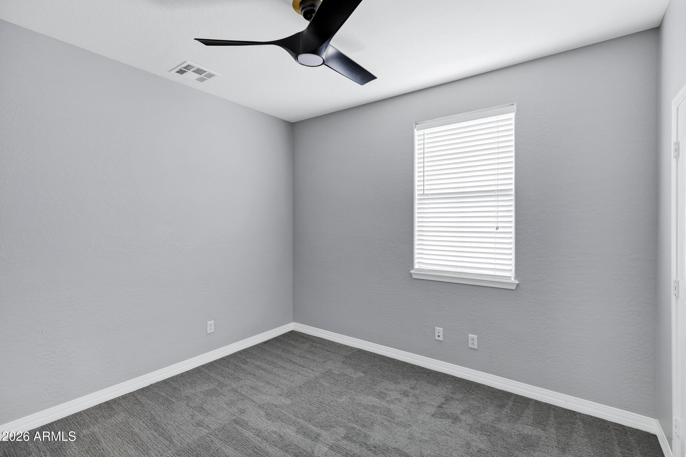 20982 West Edith Way Buckeye, AZ 85396 - Photo 28 of 57 a view of an empty room with a window