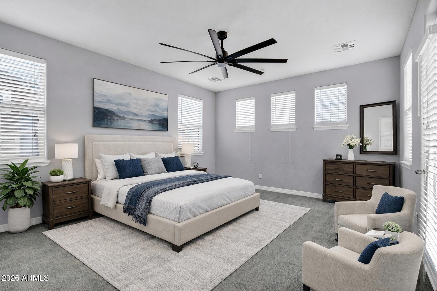 20982 West Edith Way Buckeye, AZ 85396 - Photo 33 of 57 a bedroom with a large bed and a window