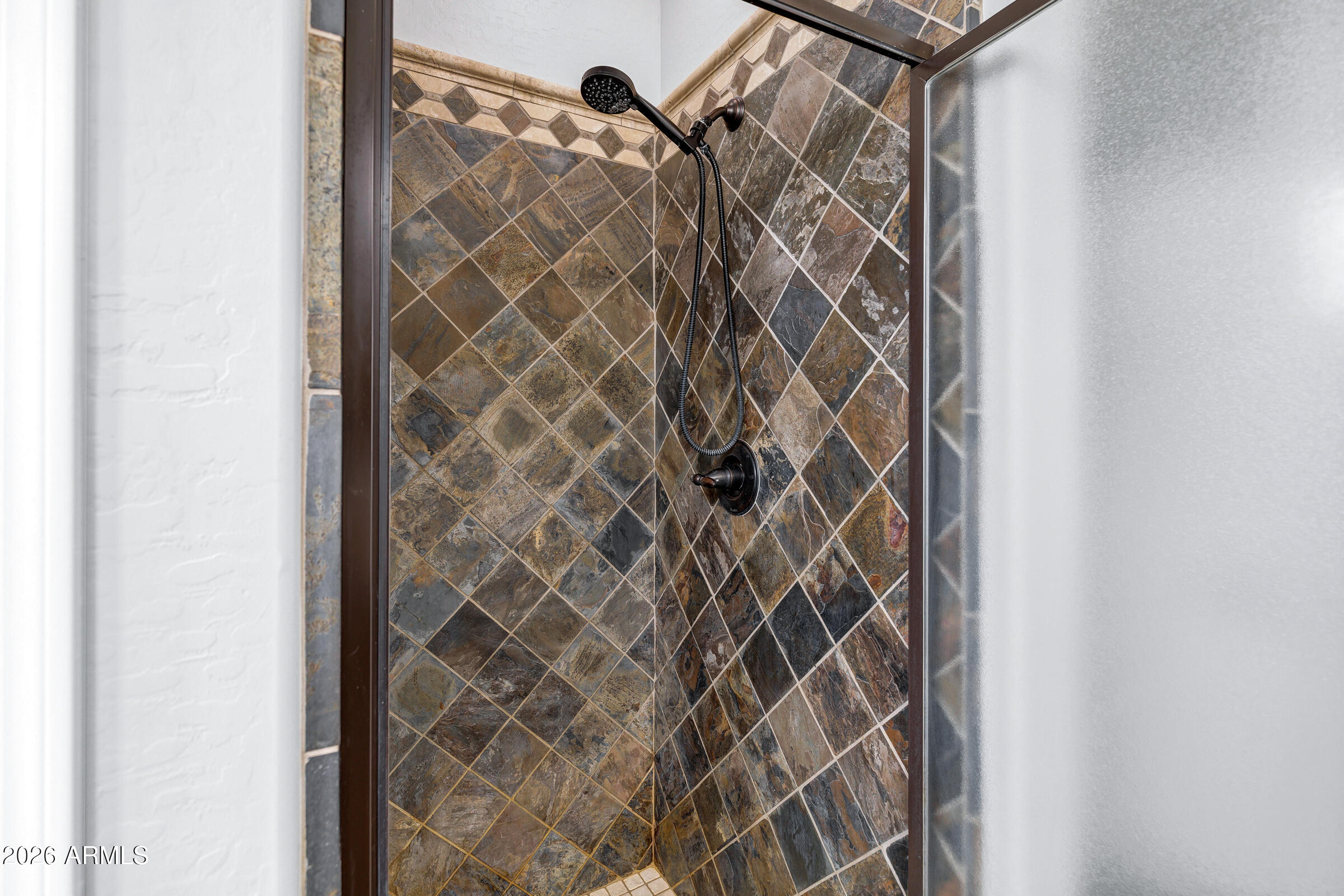 20982 West Edith Way Buckeye, AZ 85396 - Photo 36 of 57 a bathroom with a shower curtain and a window