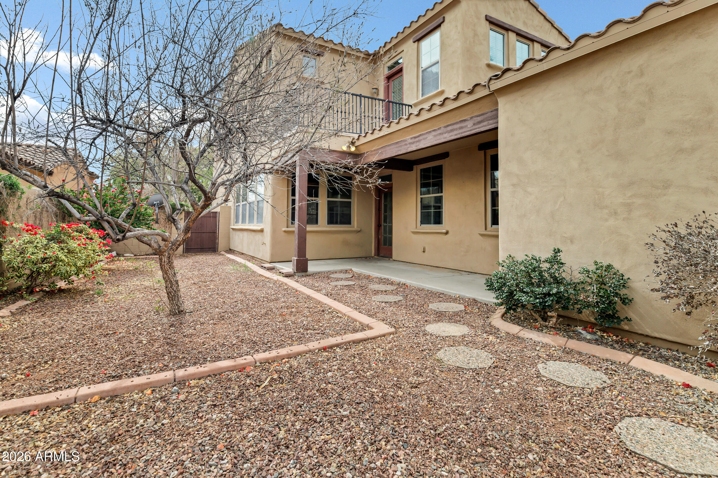 20982 West Edith Way Buckeye, AZ 85396 - Photo 43 of 57 a front view of a house with garden