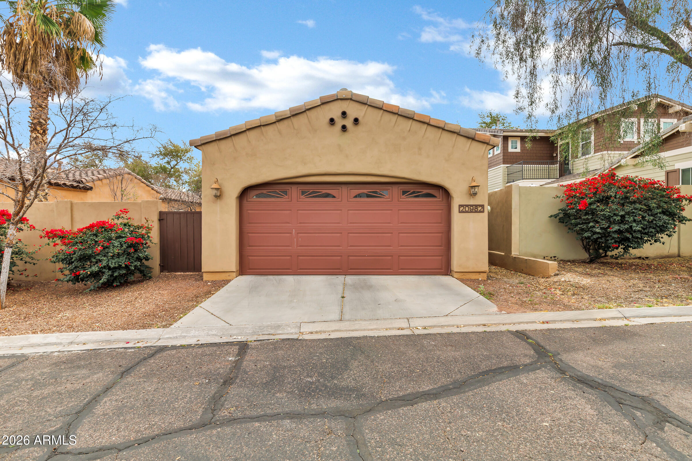 20982 West Edith Way Buckeye, AZ 85396 - Photo 47 of 57 a front view of a house with plants