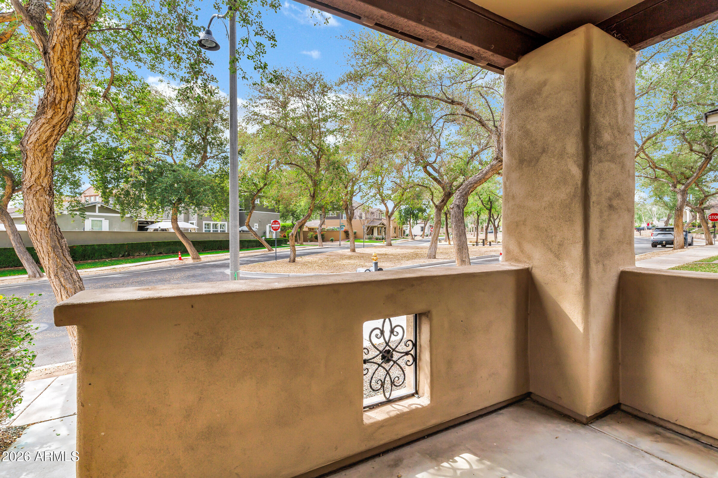 20982 West Edith Way Buckeye, AZ 85396 - Photo 5 of 57 a roof deck with table and chairs and potted plants
