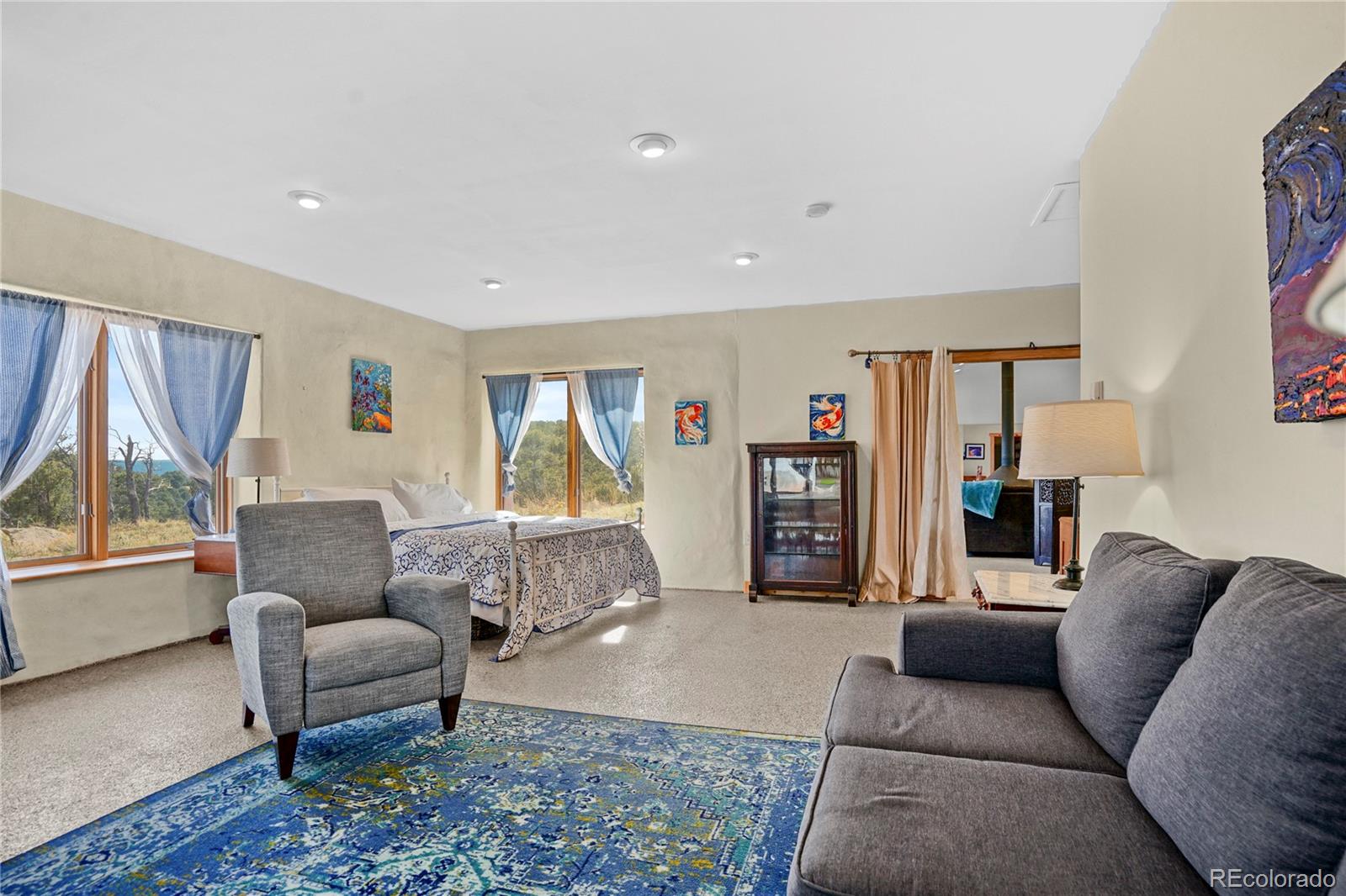 13045 Picketwire Road Boncarbo, CO 81024 - Photo 12 of 40 a living room with furniture and a window
