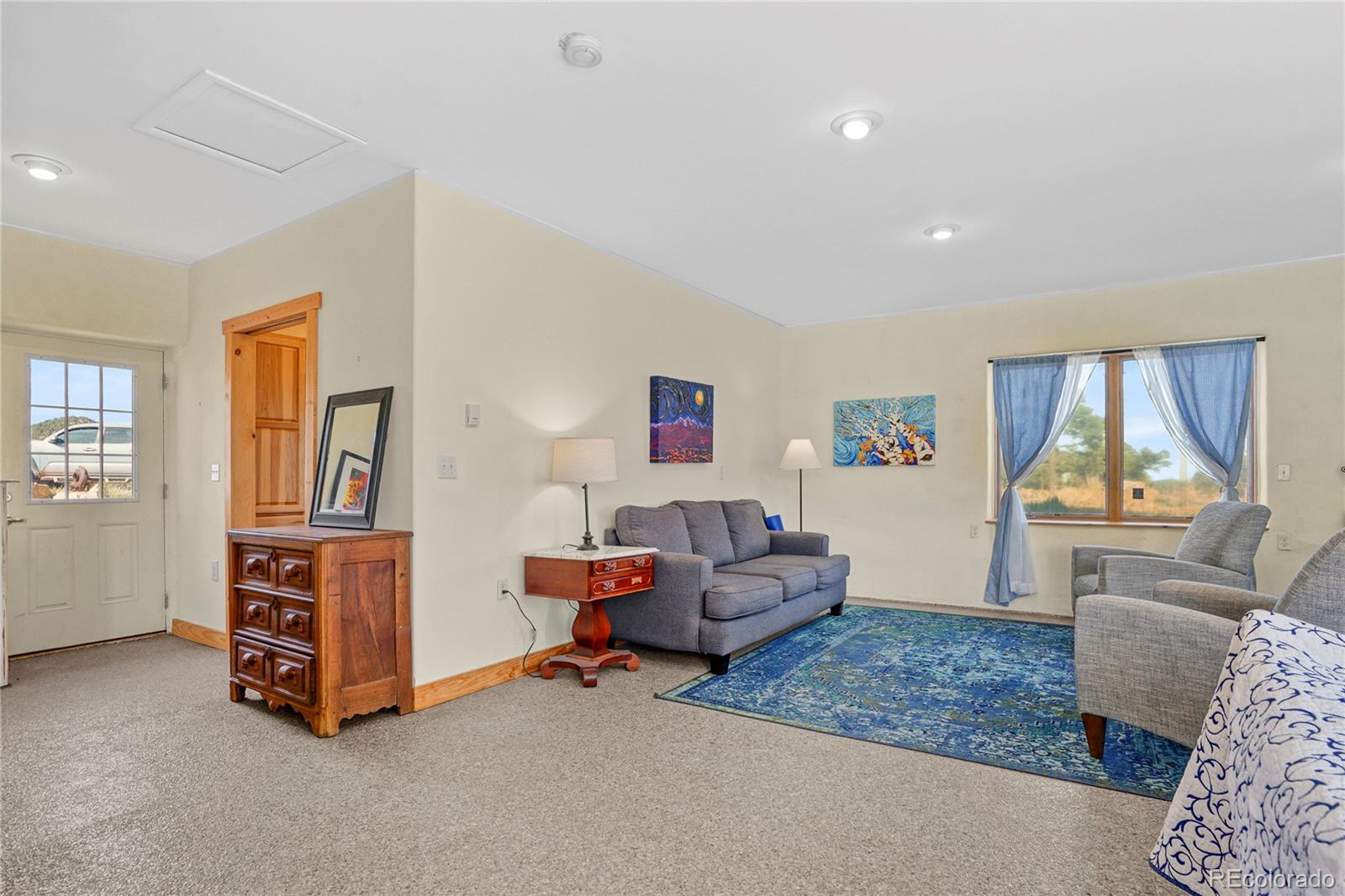 13045 Picketwire Road Boncarbo, CO 81024 - Photo 13 of 40 a living room with furniture and a window