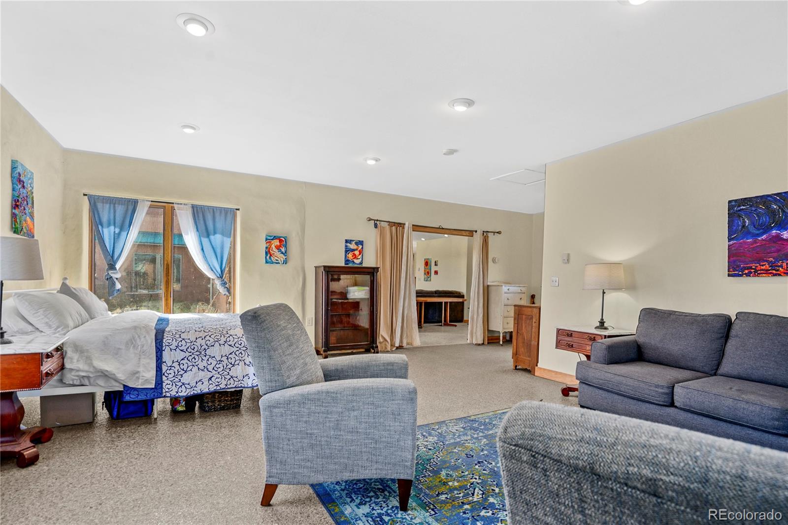 13045 Picketwire Road Boncarbo, CO 81024 - Photo 14 of 40 a living room with furniture and a flat screen tv