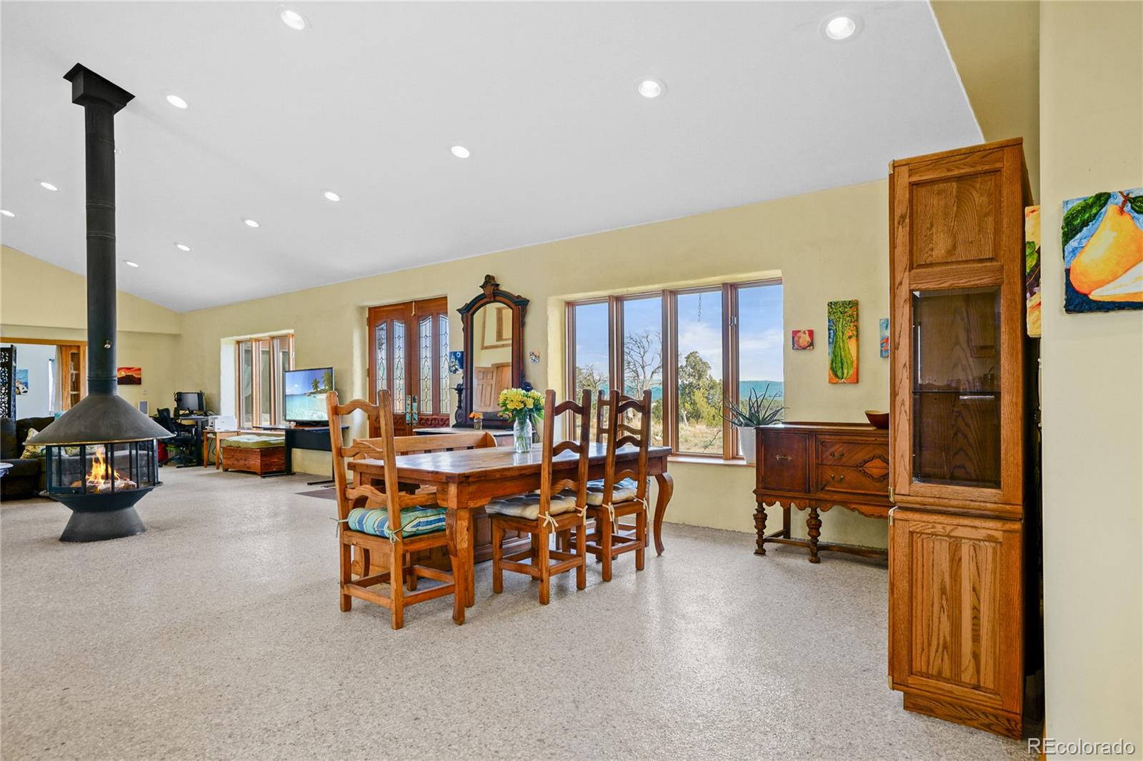 13045 Picketwire Road Boncarbo, CO 81024 - Photo 10 of 40 a living room with fireplace furniture and a large window