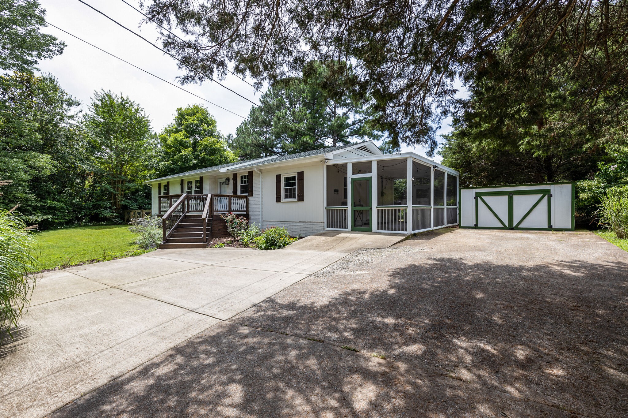 7316 Chester Road Fairview, TN 37062 - Photo 2 of 29 a view of a house with a yard and large trees