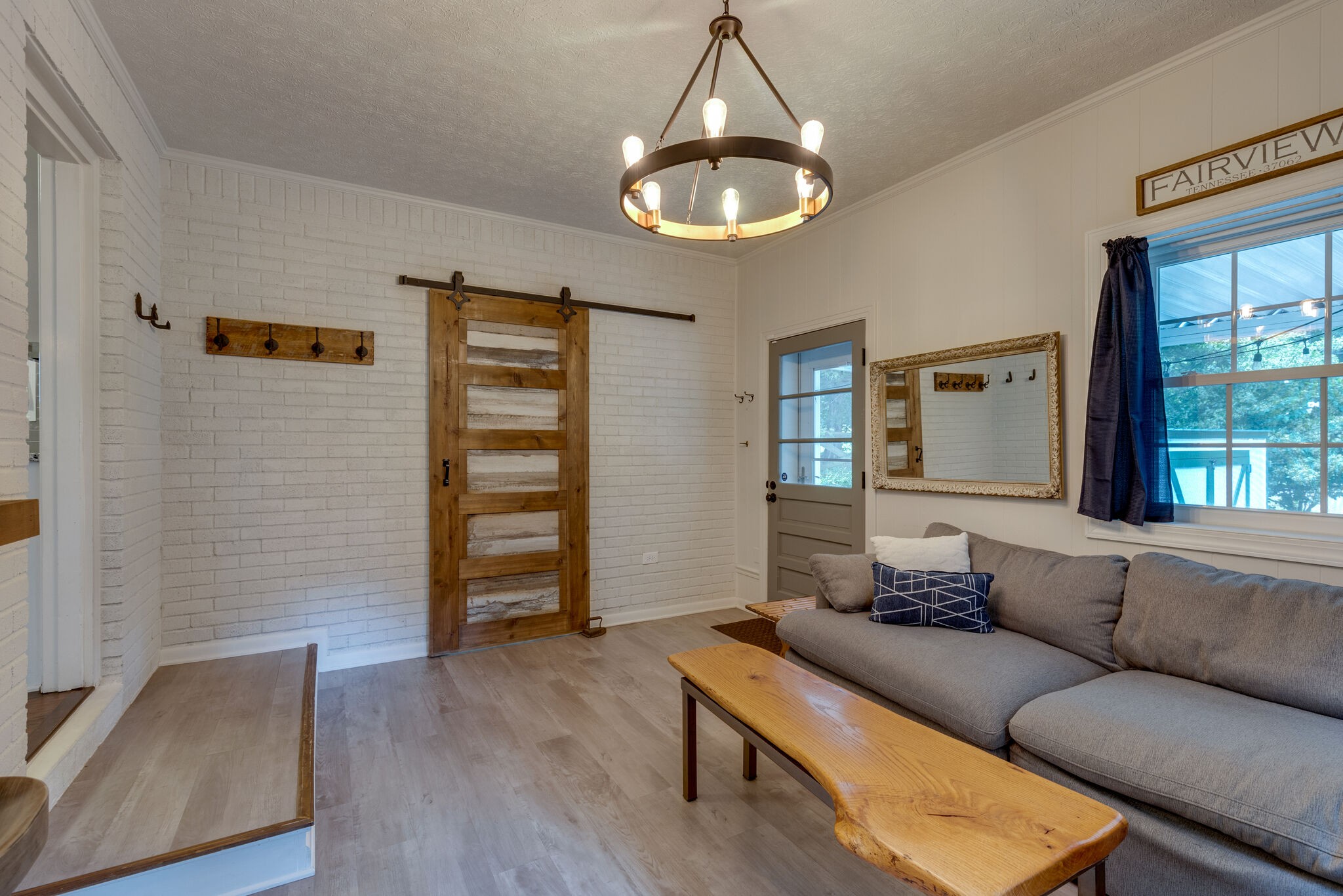 7316 Chester Road Fairview, TN 37062 - Photo 14 of 29 a living room with furniture and a chandelier