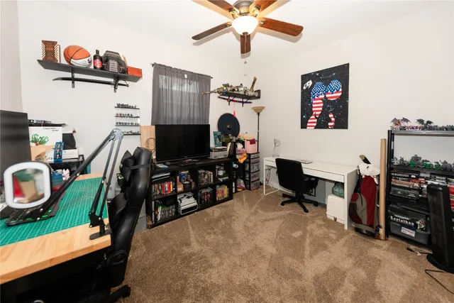 a view of a livingroom with furniture and a flat screen tv