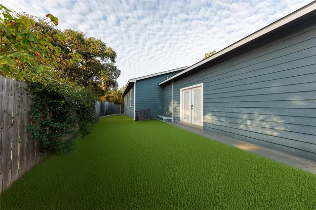 a backyard of a house with lots of green space