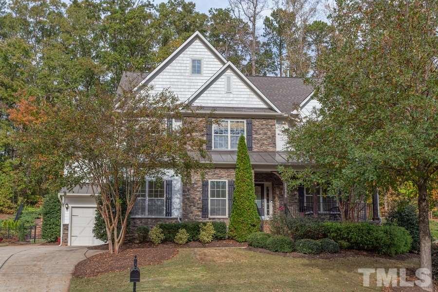 12816 Edsel Drive Raleigh, NC 27613 - Photo 1 of 25 a front view of a house with a yard and garage
