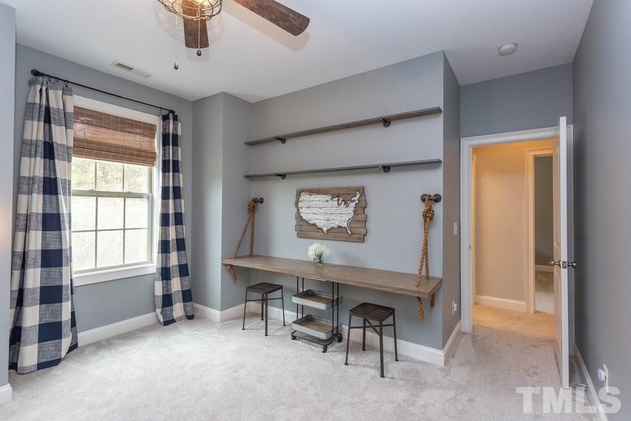 12816 Edsel Drive Raleigh, NC 27613 - Photo 19 of 25 a view of room with window and furniture
