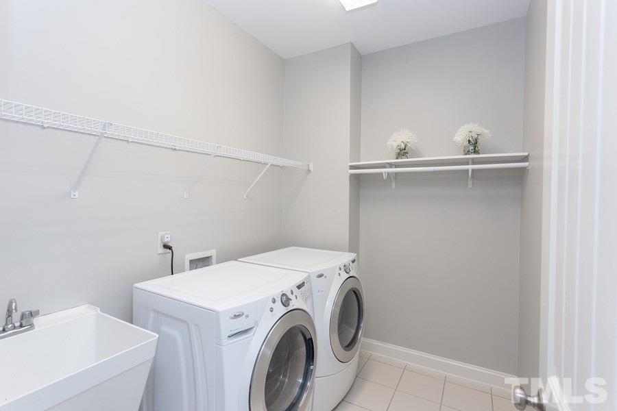 12816 Edsel Drive Raleigh, NC 27613 - Photo 23 of 25 a utility room with dryer and washer
