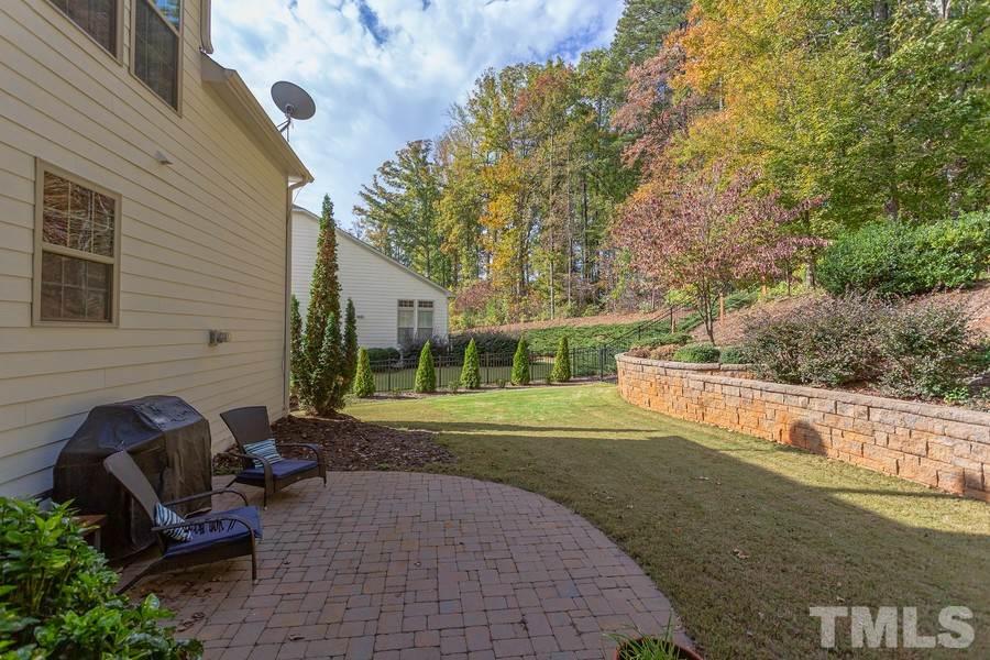 12816 Edsel Drive Raleigh, NC 27613 - Photo 25 of 25 a view of backyard with seating area and green space