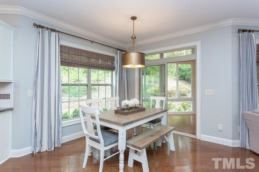 12816 Edsel Drive Raleigh, NC 27613 - Photo 10 of 25 a dining room with furniture window wooden floor